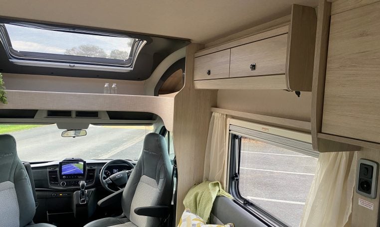 2023 Auto-Trail F-Line F74 motorhome interior view showing the front lounge overhead storage.