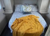 2023 Auto-Trail F-Line F74 motorhome interior view showing the spacious bedroom with a rear island bed.