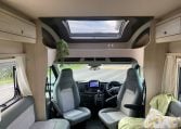 2023 Auto-Trail F-Line F74 motorhome interior view showing the front lounge with cab swivel seats.