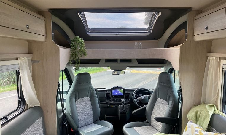 2023 Auto-Trail F-Line F74 motorhome interior view showing the front lounge with cab swivel seats.