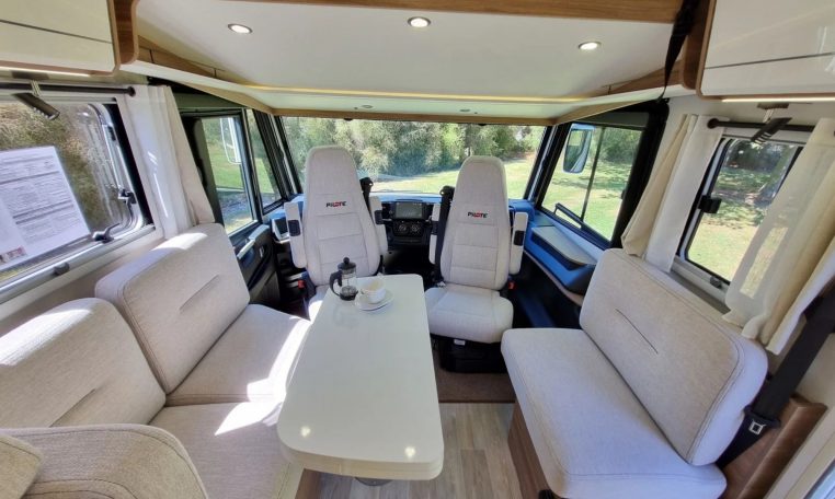Fiat Ducato Pilote G740FC motorhome interior view showcasing the front dining.