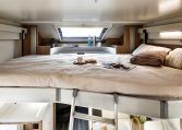Drop-down bed inside a Roller Team Auto-Roller 747 motorhome providing additional sleeping space.