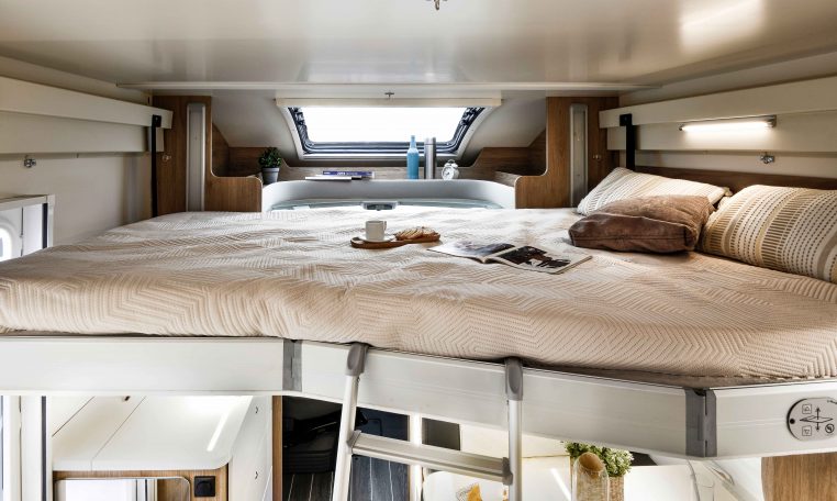 Drop-down bed inside a Roller Team Auto-Roller 747 motorhome providing additional sleeping space.