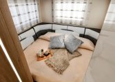 Roller Team Auto-Roller 747 motorhome rear lounge converting into a comfortable bed with flexible seating and practical storage.