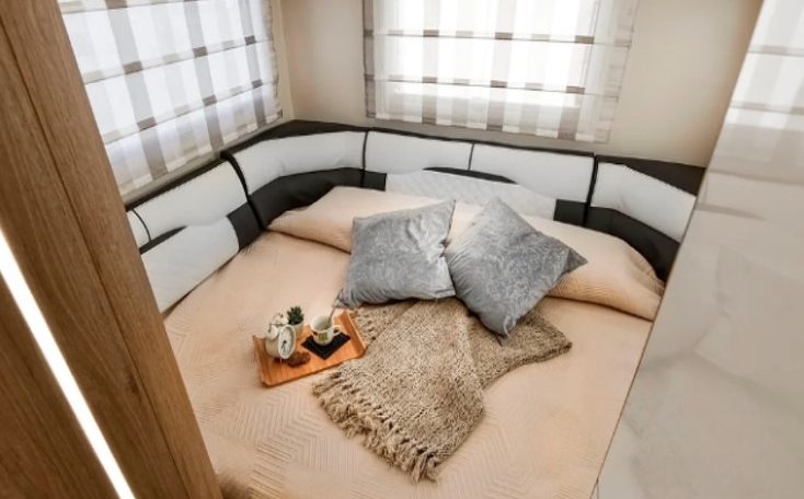 Roller Team Auto-Roller 747 motorhome rear lounge converting into a comfortable bed with flexible seating and practical storage.