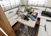 Roller Team Auto-Roller 747 motorhome rear U-shaped lounge with spacious seating, large windows and a bright, comfortable social area.