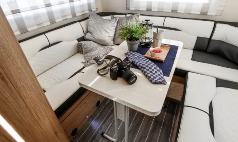 Roller Team Auto-Roller 747 motorhome rear U-shaped lounge with spacious seating, large windows and a bright, comfortable social area.