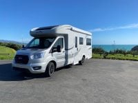 Exterior front and passenger side view of a Roller Team Auto-Roller 747 motorhome showing cab, headlights, side profile, and exterior design.