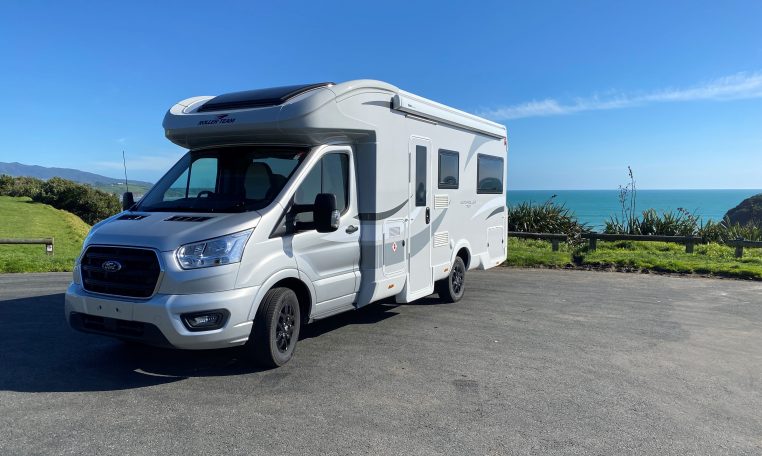 Exterior front and passenger side view of a Roller Team Auto-Roller 747 motorhome showing cab, headlights, side profile, and exterior design.