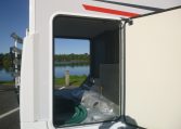 Large garage in a Roller Team Zefiro 665 motorhome with access on both sides for storing equipment and luggage.