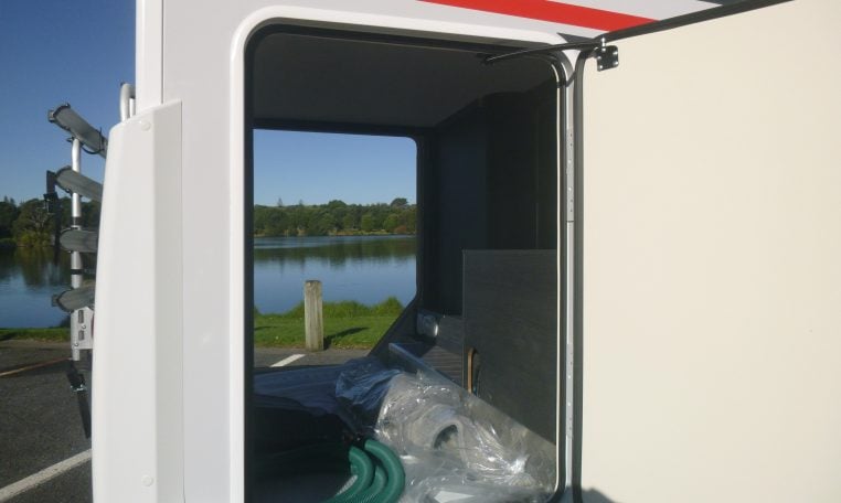 Large garage in a Roller Team Zefiro 665 motorhome with access on both sides for storing equipment and luggage.
